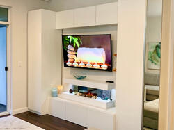 Custom built-in media wall with modern fireplace